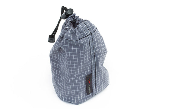 A Size 1 Northwest Sky (light grey with white grid) 200 Halcyon Travel Suff Sack cinched shut.